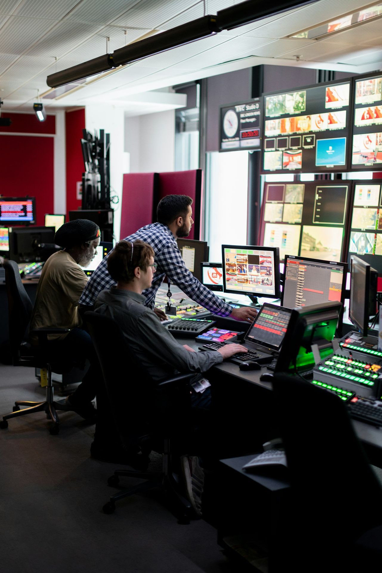 Operators monitoring an industrial control room