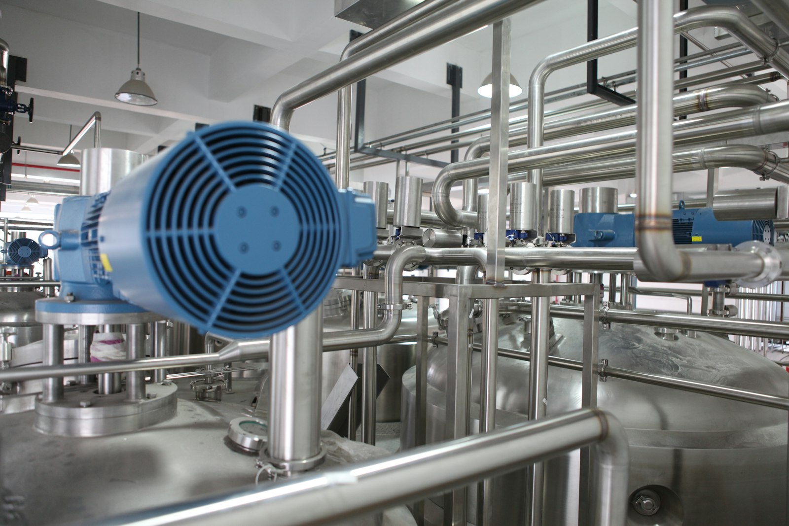 Stainless steel process plant with pumps and piping