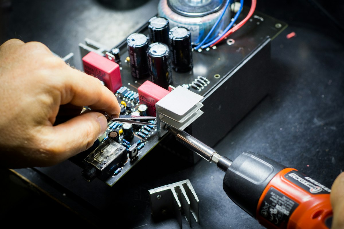 Technician working on an electronic circuit board